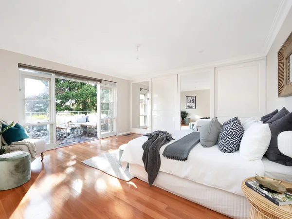 Example photo: a styled bedroom opening to a deck