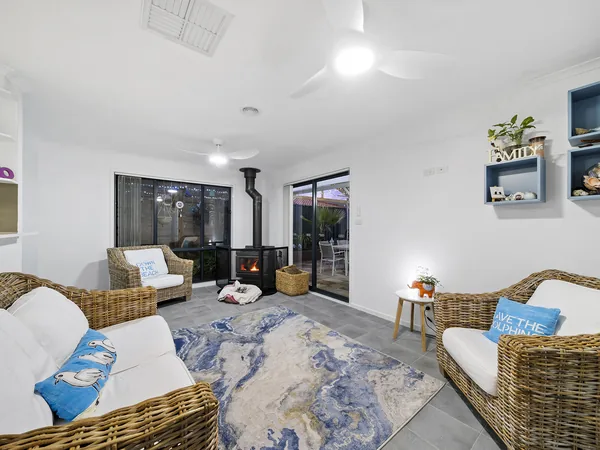 Example photo: a lounge with a wood heater
